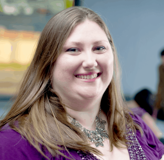 Photo of female in purple blouse.